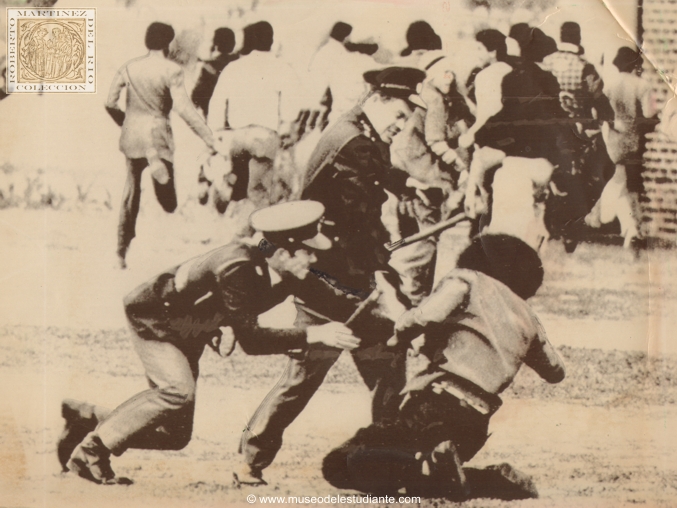 South Africa: Policemen with clubs subdue black student demonstrator disorders at the university here 8/13. South Africa police flew in reinforcements from Johannesburg early 8/13 to help seal off three black townships outside Cape Town where 27 persons were killed in the latest anti-government rioting