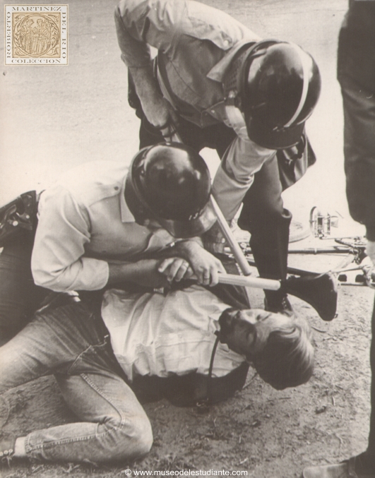 Madison, Wis., May 5. End of bike ride. University of Wisconsin student is hauled off his bike and taken into police car yesterday during continuing student war against Madison Police Department. At least 60 persons were arrested