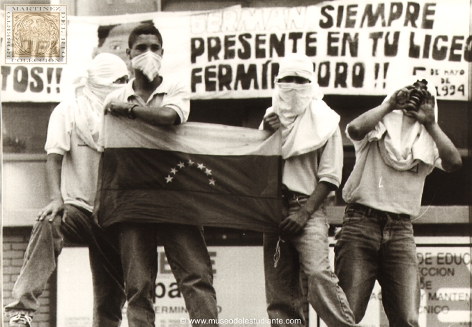 Venezuela, Caracas. Hooded students protest in front of Fermin Toro high school, one block from the presidential palace in Caracas, May 8. Protesters said they were demonstrating against the alleged police killing last year of one of their fellow students. At least 20 students were arrested by police and three people were injured