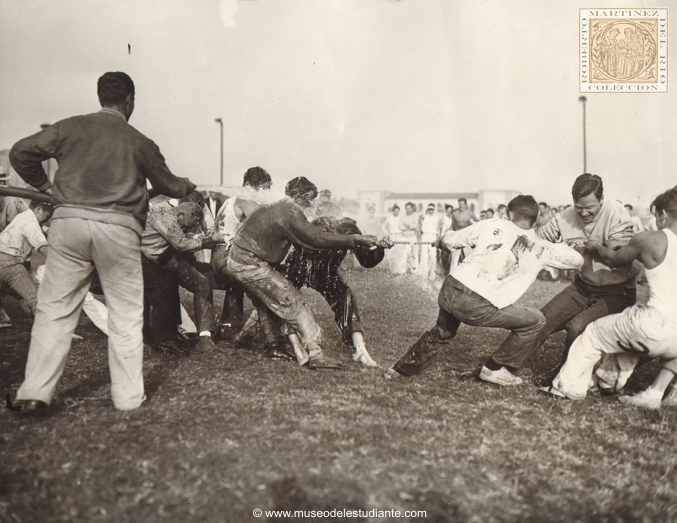 Hold 'Em, Frosh! While an upperclassman played a hose on them, freshmen and sophomores at University of California at Los Angeles engaged in annual tug-of-war yesterday at Westwood campus. Freshmen lost and were ignominiously dragged through mud by sophomores