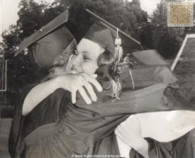 Graduation with special meaning. Negro graduates, Charlayne Hunter and Hamilton Holmes, both of Atlanta, embrace after receiving their diplomas during the University of Georgia's 160th commencement exercises. The two were the first Negroes to attend the university, and Charlayne is a former Wayne State University student