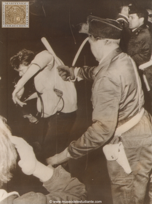 Student Clubbed. Stockholm, Sweden, is having its trouble with militant students too. Here, a student demonstrator is clubbed by policeman during a melee outside the opera house in the Swedish capital over the weekend. The demonstrators had marched on the center of the city and tried to take over. Police restored order in a few hours